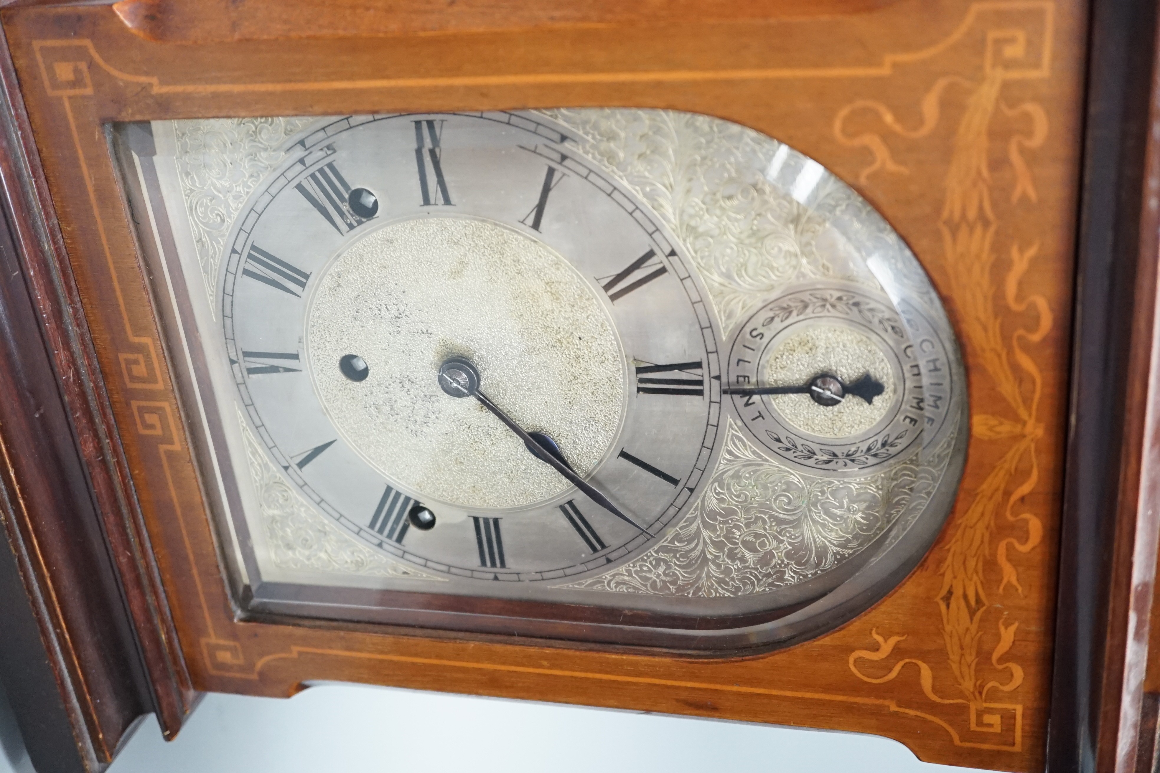 An early 20th century German walnut and marquetry chiming mantel clock, 42cms high